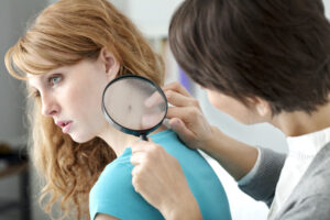 Woman having her skin cancer screening in Leesburg, FL